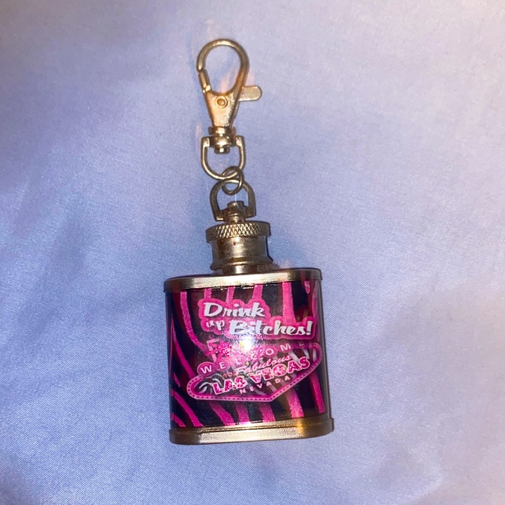 This is a 2000’s little keychain of a zebra print flask. From Las Vegas.